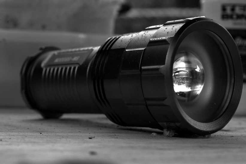 Close up shot of black flashlight