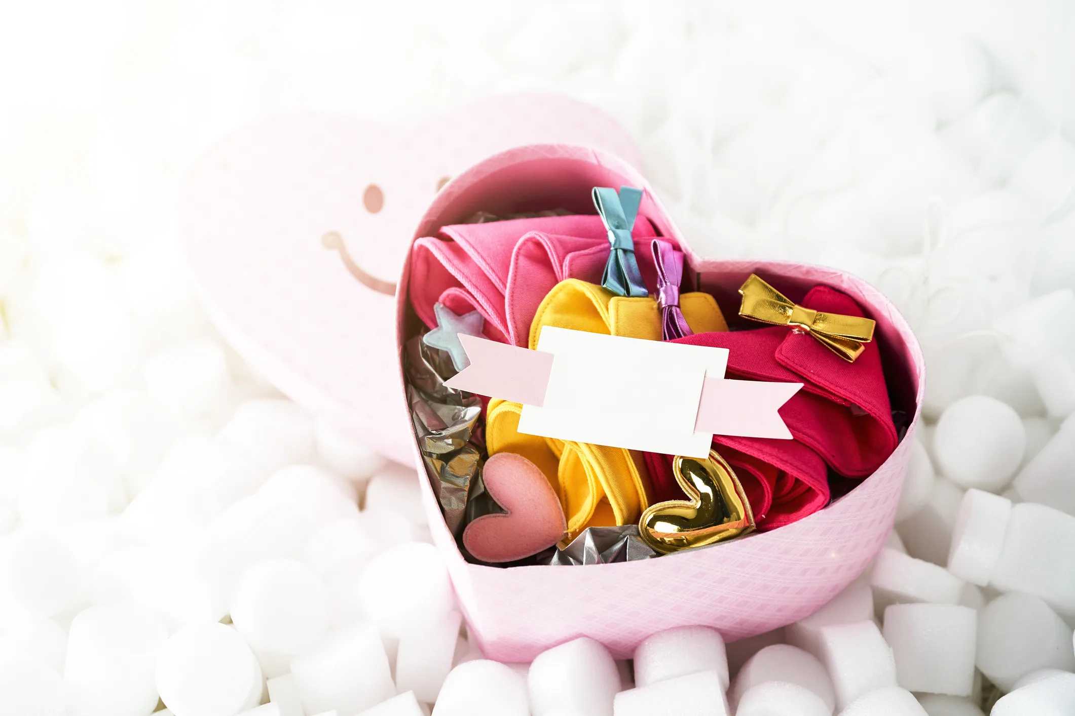 Cute, Easy, and Doable Valentine’s Day Gift Baskets for Kids: Basket filled with pajamas, hair clips, toys, and Valentines hearts