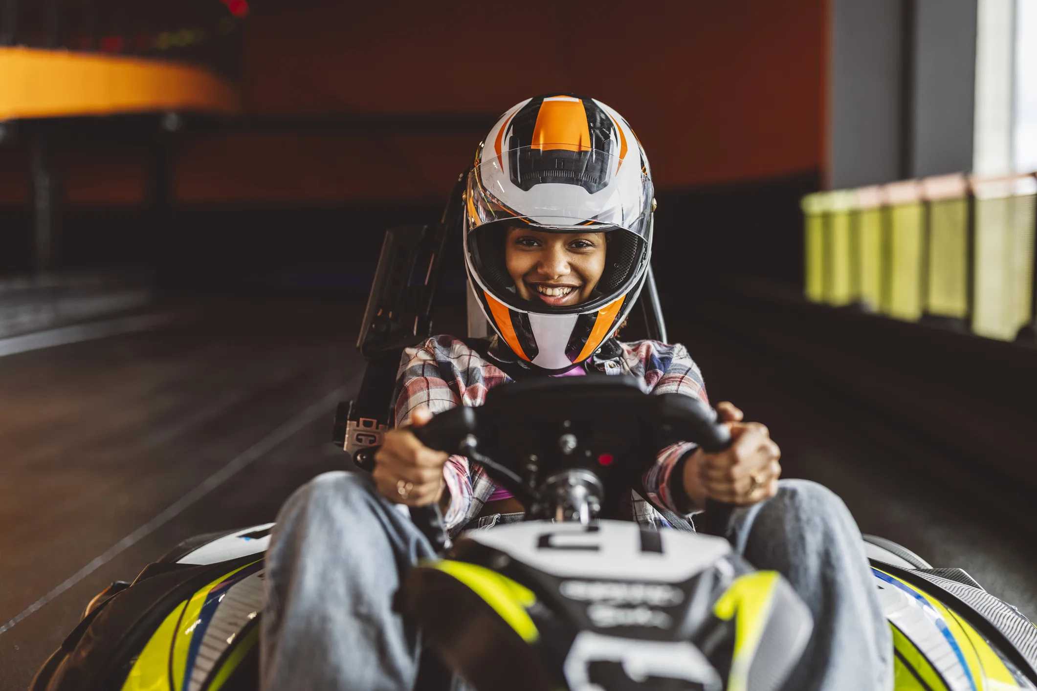Best Go-Karts Near NYC for Kids & Families: Kid go-karting indoors.