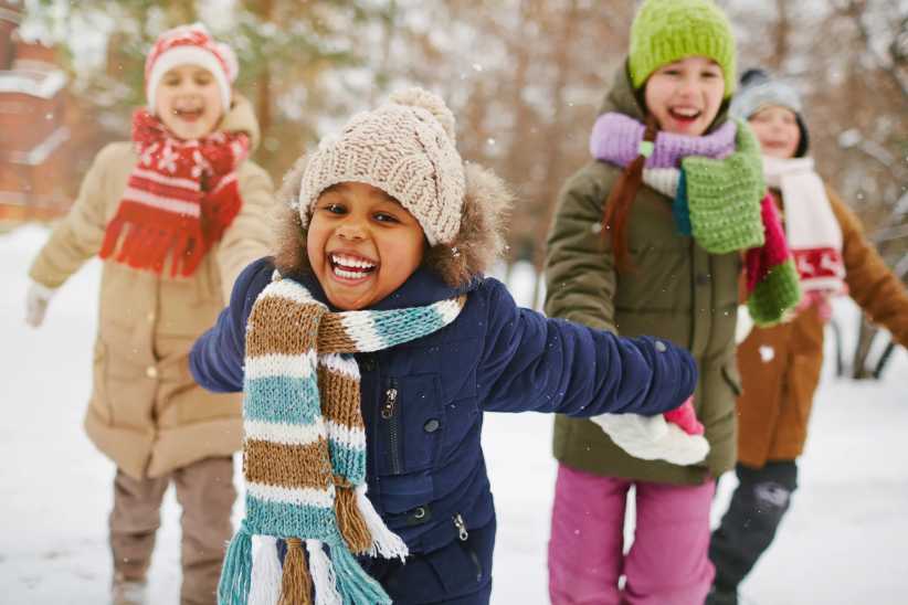 Cheerful girl and her friends spending time outdoors on February mid-winter break NYC