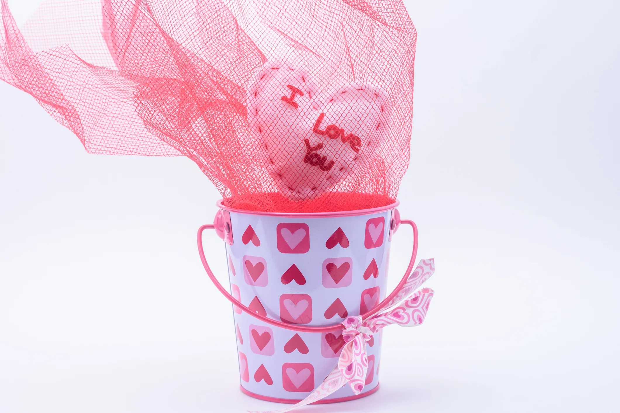 Cute, Easy, and Doable Valentine’s Day Gift Baskets for Kids: Valentine's Day basket with felt heart and love notes