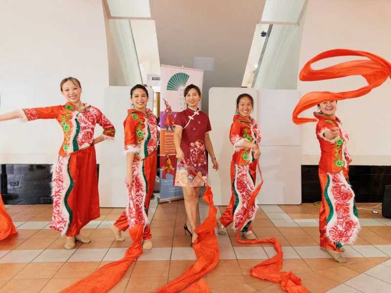 Lunar New Year performers dressed in costume for performance