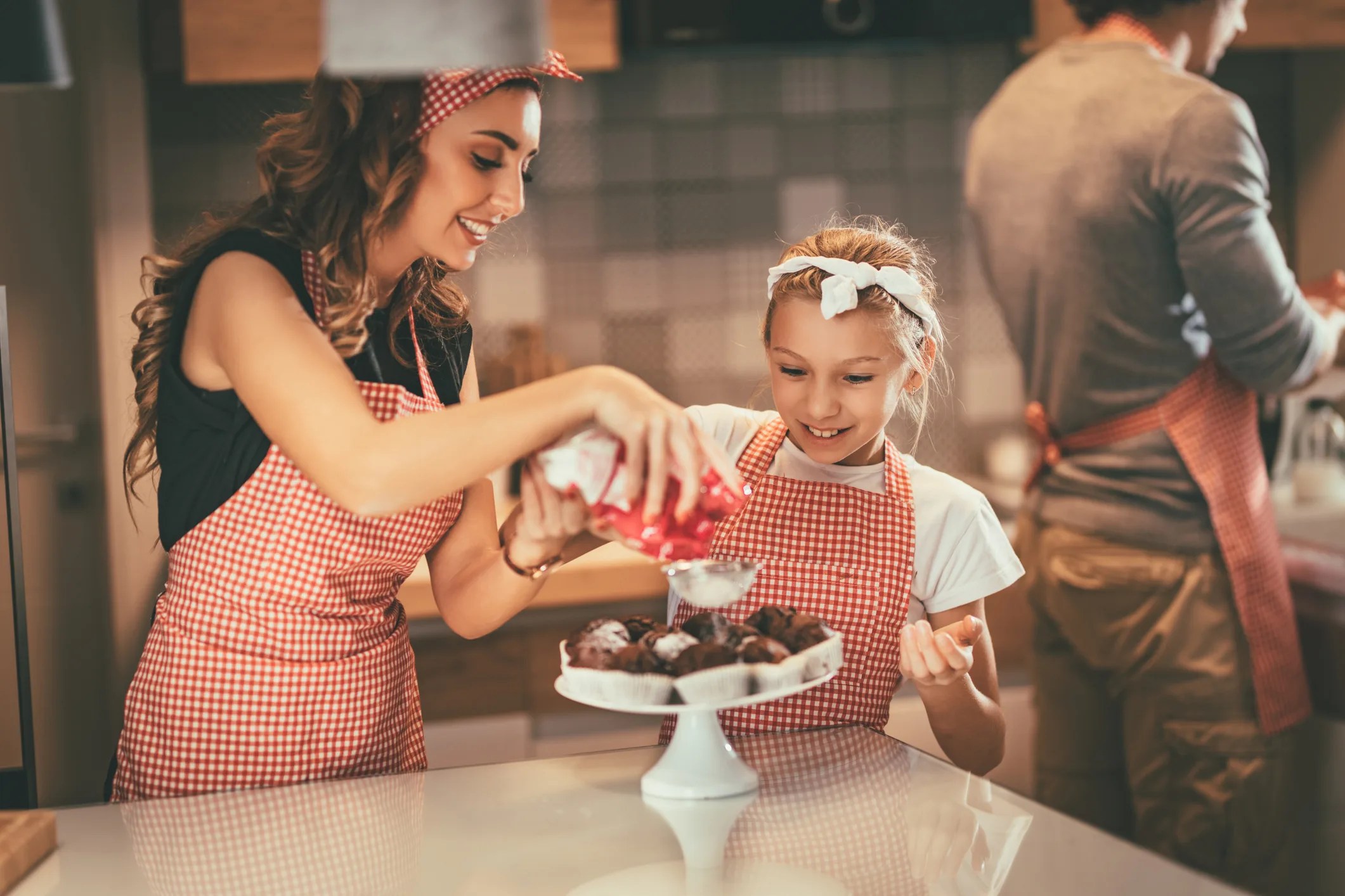Mom and Me Valentine’s Day Date Ideas in NYC: Chocolate and Baking Workshops. Mom and daughter baking chocolate treats together