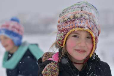 girl outside in a winter hat