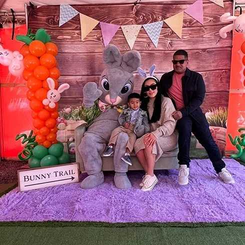 family posing with easter bunny